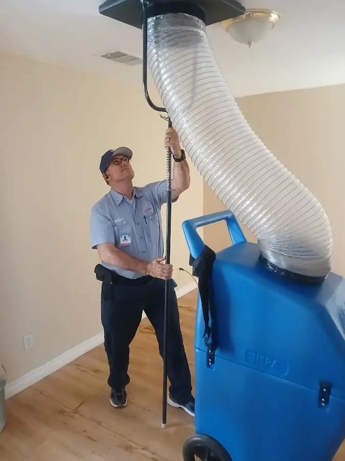 HVAC Installation technician using HEPA equipment in Gates